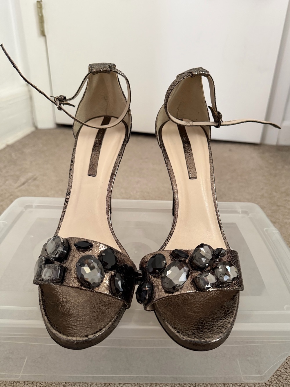 Classic Metallic Copper Bronze Ankle-Strap High Heels with Black Gem Accents.